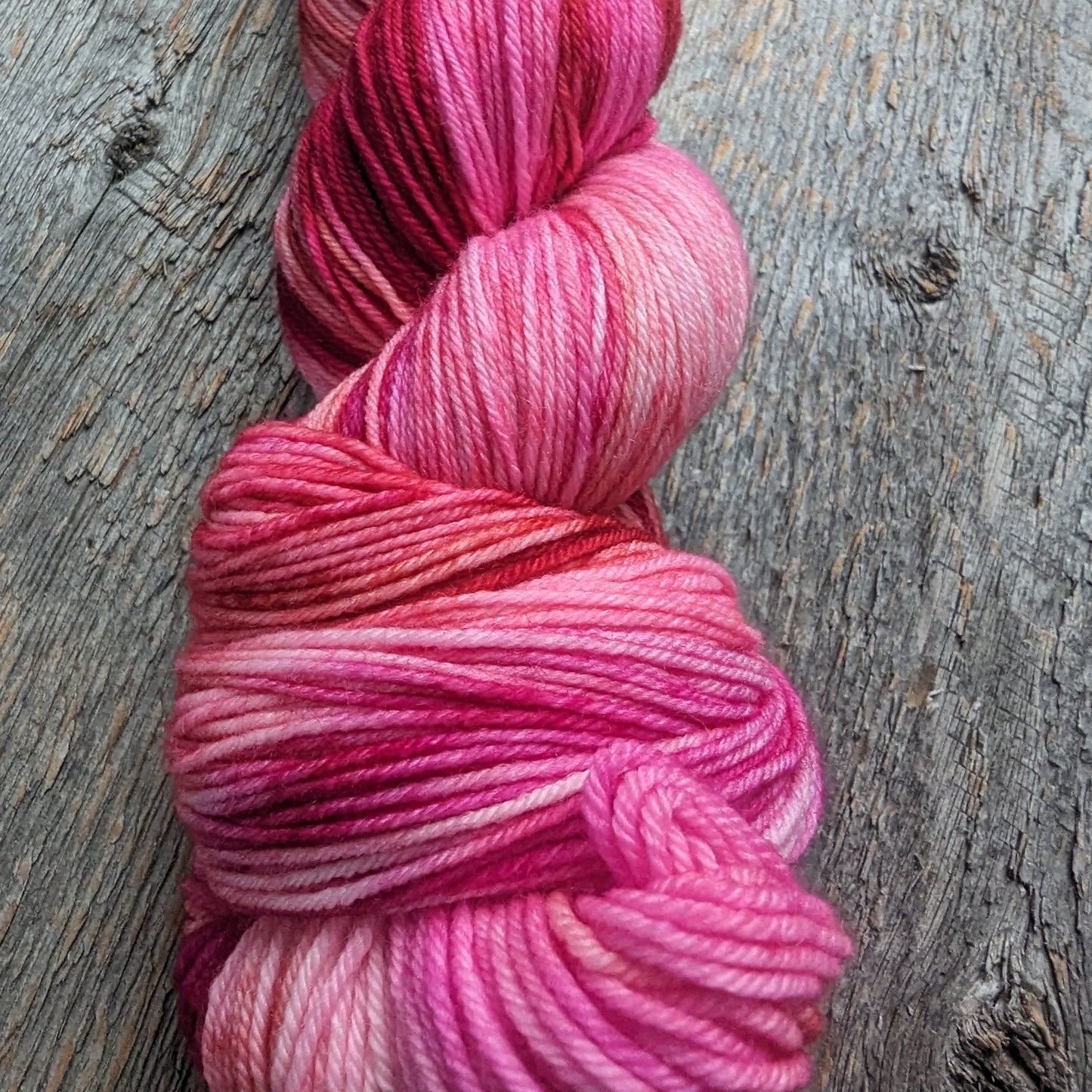 pink hand dyed yarn, red hand dyed yarn, sock yarn, twisted skein, Keenan hand dyed, merino yarn, wool yarn, merino nylon yarn