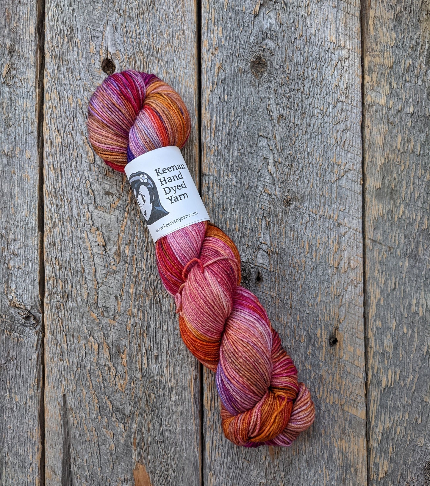 multicolored hand dyed yarn, red purple orange hand dyed yarn, sock yarn, twisted skein, Keenan hand dyed, merino yarn, wool yarn, merino nylon yarn
