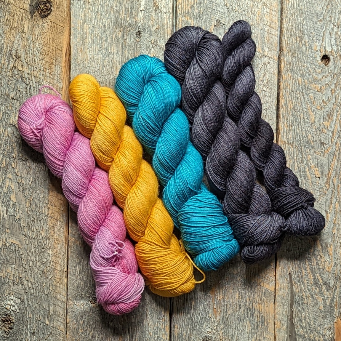 pink hand dyed yarn, yellow hand dyed yarn, teal hand dyed yarn, black hand dyed yarn, sock yarn, twisted skein, Keenan hand dyed, merino yarn, wool yarn, merino nylon yarn