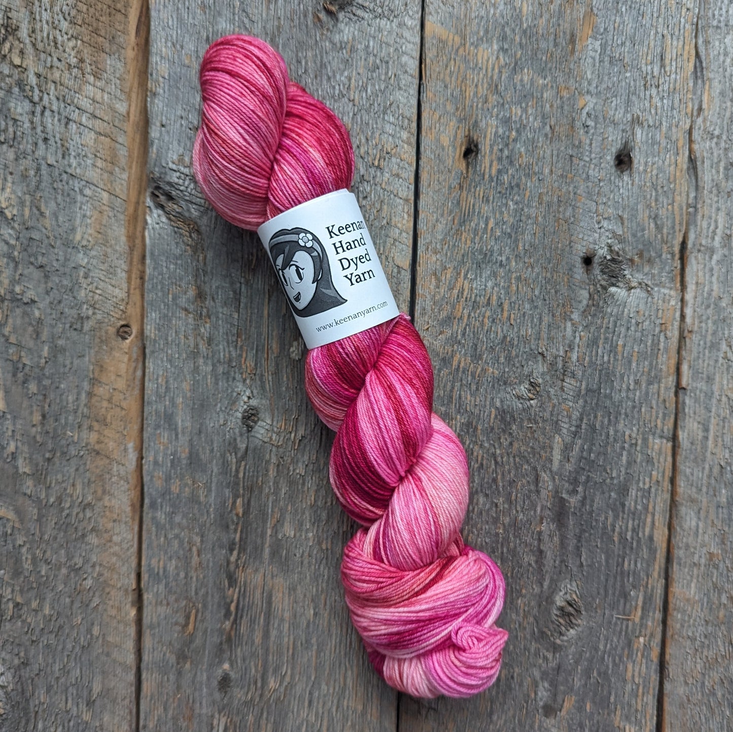 pink hand dyed yarn, red hand dyed yarn, sock yarn, twisted skein, Keenan hand dyed, merino yarn, wool yarn, merino nylon yarn