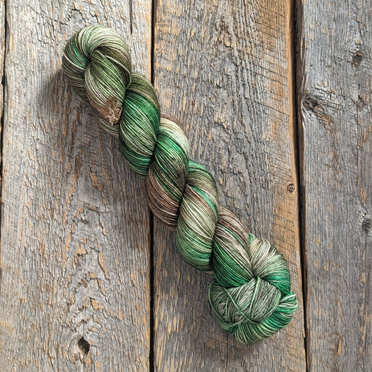 twisted skein, emerald green yarn, dark green yarn, brown yarn