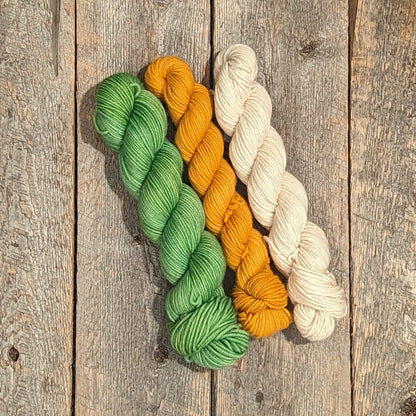 green twisted skein, orange twisted skein, and white twisted skein, 100% wool