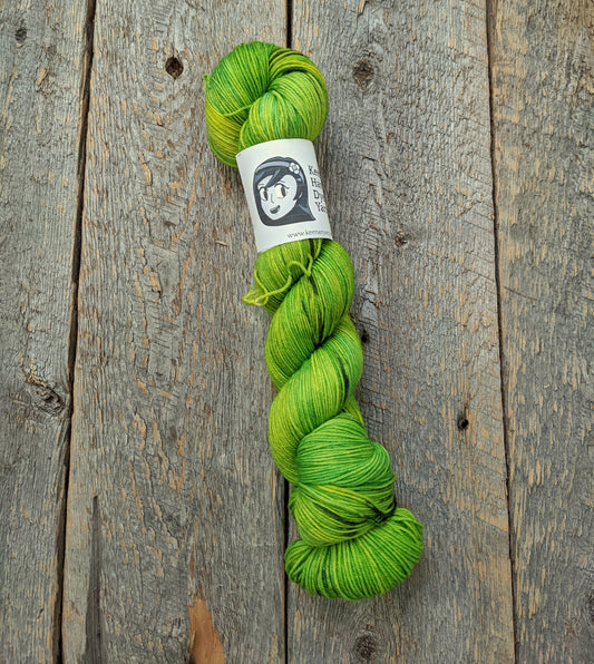 lime green hand dyed yarn, dragonfly, purple streaks, sock yarn, twisted skein, merino nylon yarn, Keenan hand dyed, multicolored yarn