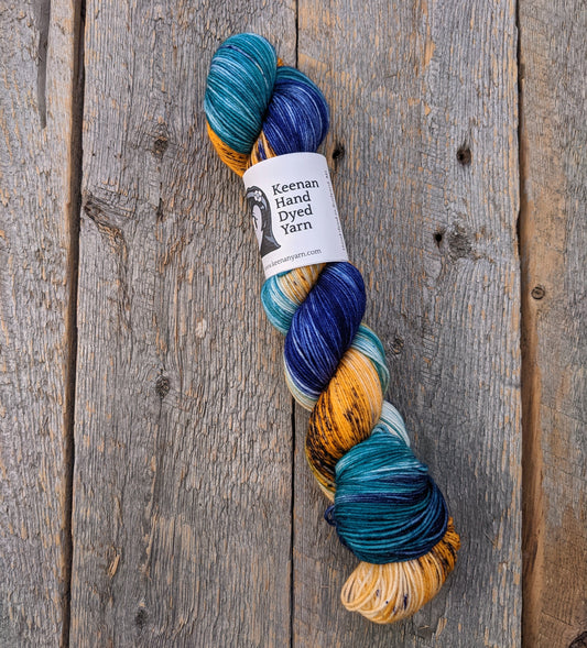 teal hand dyed yarn, dark blue hand dyed yarn, speckled yarn, orange hand dyed yarn, sock yarn, twisted skein, Keenan hand dyed, merino yarn, wool yarn, merino nylon yarn
